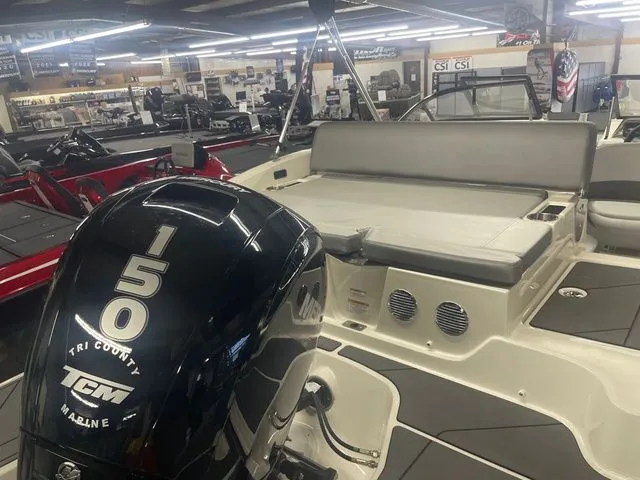 Slide: The Image of 2023 Bayliner DX 2000 with 150 HP engine in showroom. - 6