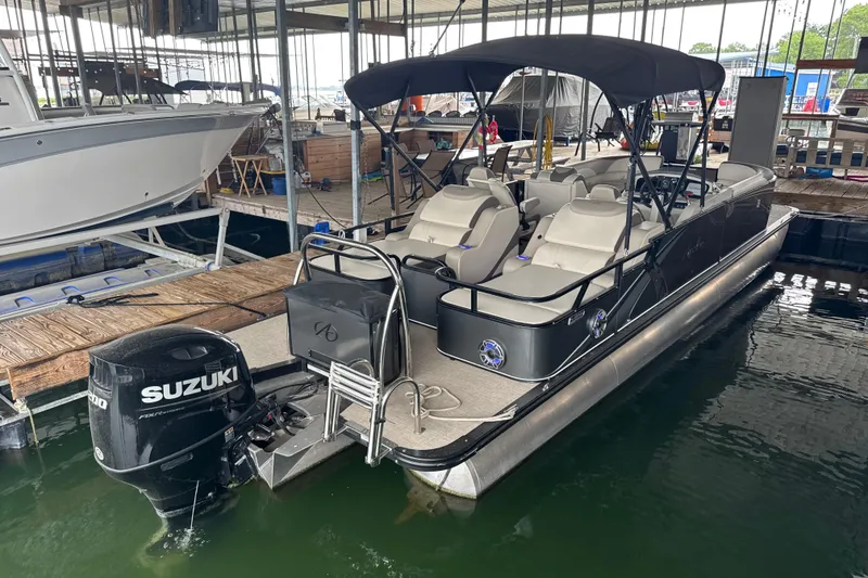 The Image of 2023 Avalon LSZ 2585 RL pontoon boat docked with Suzuki outboard motor. - 0