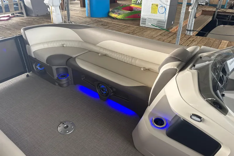 Slide: The Image of Luxurious interior of 2023 Avalon LSZ 2585 RL pontoon boat with ambient blue lighting. - 5