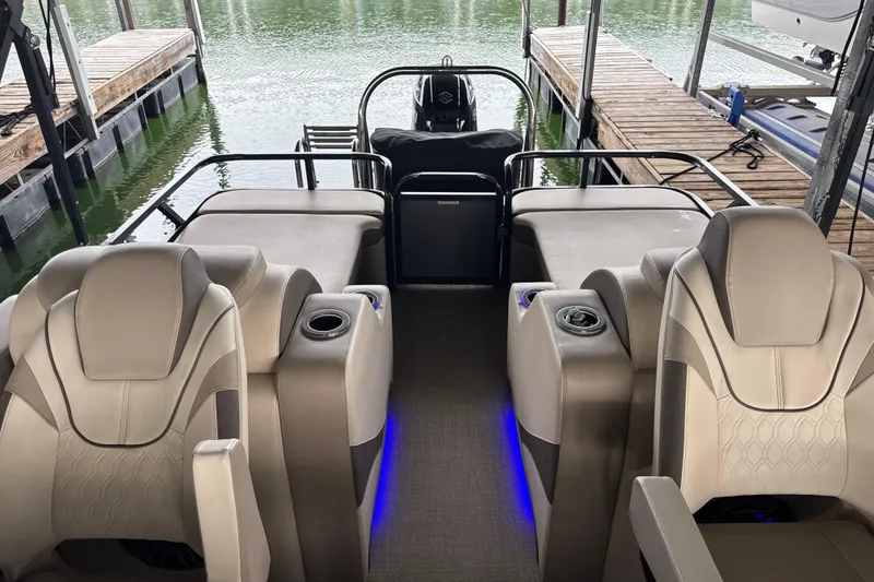 Slide: The Image of 2023 Avalon LSZ 2585 RL pontoon boat interior with luxurious seating and ambient lighting. - 7
