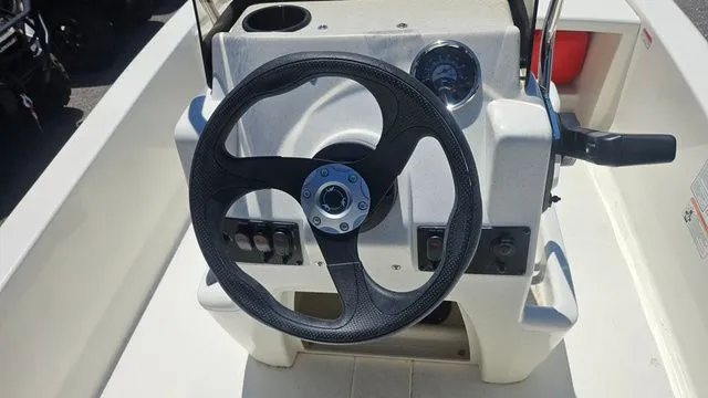 Slide: The Image of Steering wheel of Mako Pro Skiff 13 CC 2026 boat. - 13