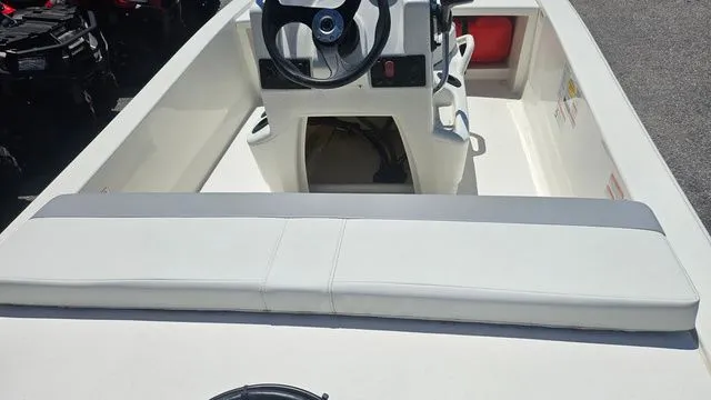 Slide: The Image of Interior view of 2026 Mako Pro Skiff 13 CC with steering console. - 14