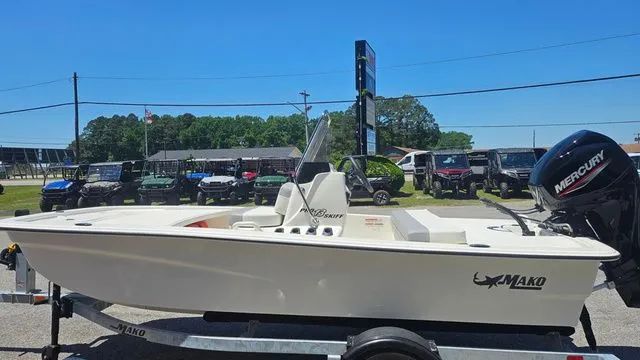 Slide: The Image of 2026 Mako Pro Skiff 13 CC boat on trailer, side view. - 7
