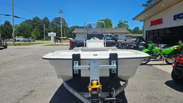 Slide: The Image of Mako Pro Skiff 13 CC 2026 on trailer outside a store. - 9