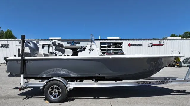 Slide: The Image of 2026 Tidewater Bay Max 1910 boat on trailer, side view. - 2