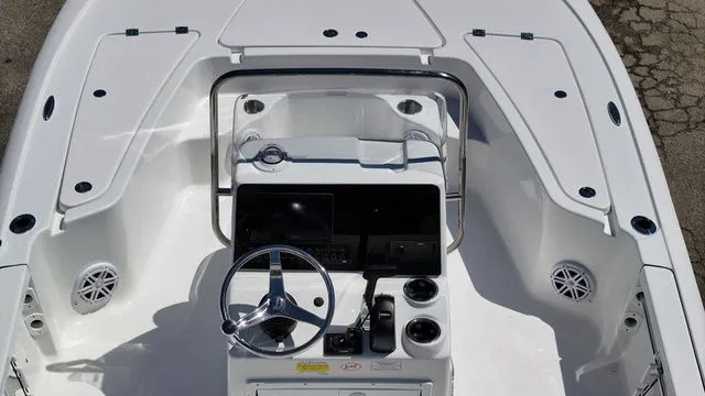 Slide: The Image of Interior view of 2026 Tidewater Bay Max 1910 boat, helm console and seating area. - 8