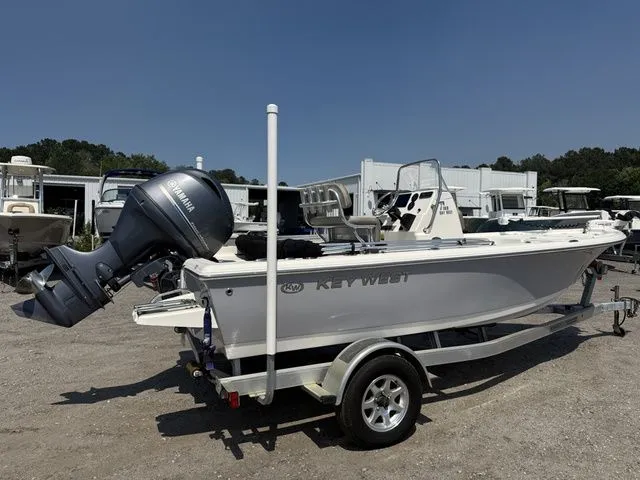 Slide: The Image of 2023 Key West 188 Bay Reef boat on trailer outdoors. - 4