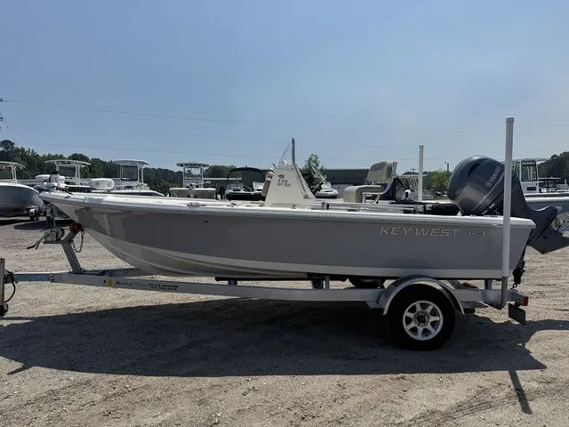 Slide: The Image of 2023 Key West 188 Bay Reef boat on trailer outdoors. - 5