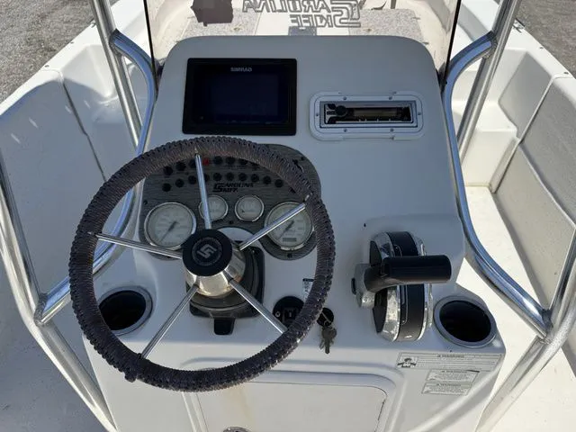 Slide: The Image of Steering console of a 2015 Carolina Skiff DLV 218 boat. - 8