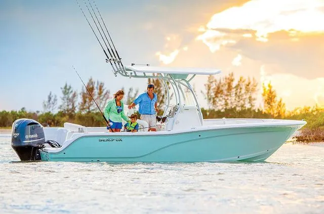 Slide: The Image of Family fishing on Sea Fox 246 Commander boat at sunset. - 6