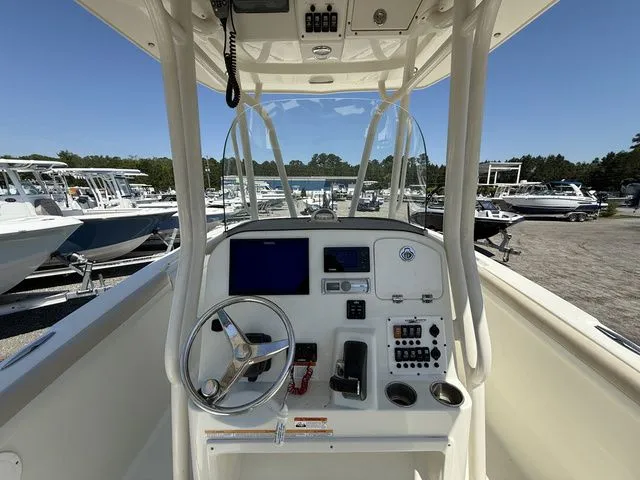 Slide: The Image of Interior view of a 2012 Hydra-Sports 2300 CC boat with helm console. - 10