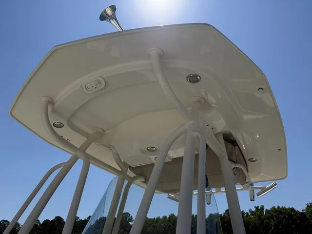 Slide: The Image of Hydra-Sports 2300 CC 2012 boat roof under blue sky. - 13