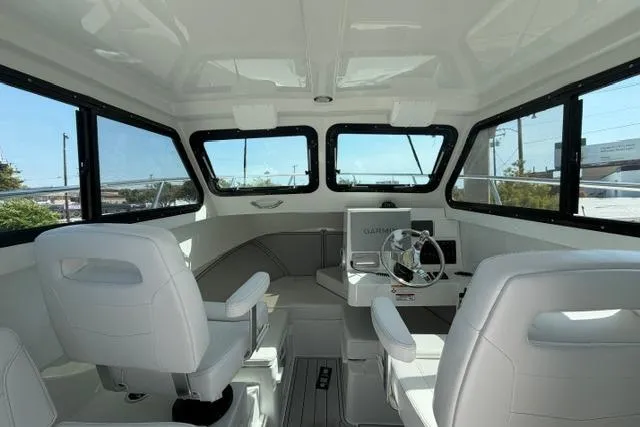Slide: The Image of Interior of 2026 Parker 227 Explorer boat with modern seating and navigation equipment. - 4