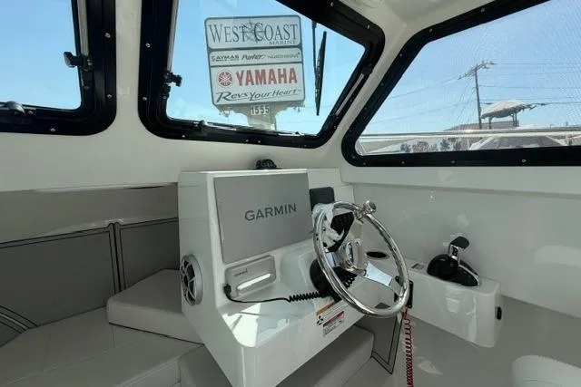 Slide: The Image of Interior of 2026 Parker 227 Explorer boat with Garmin navigation system. - 5