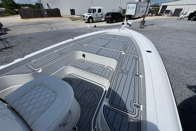 Slide: The Image of 2019 ShearWater 270 Carolina Flare boat deck with sleek design and seating. - 13
