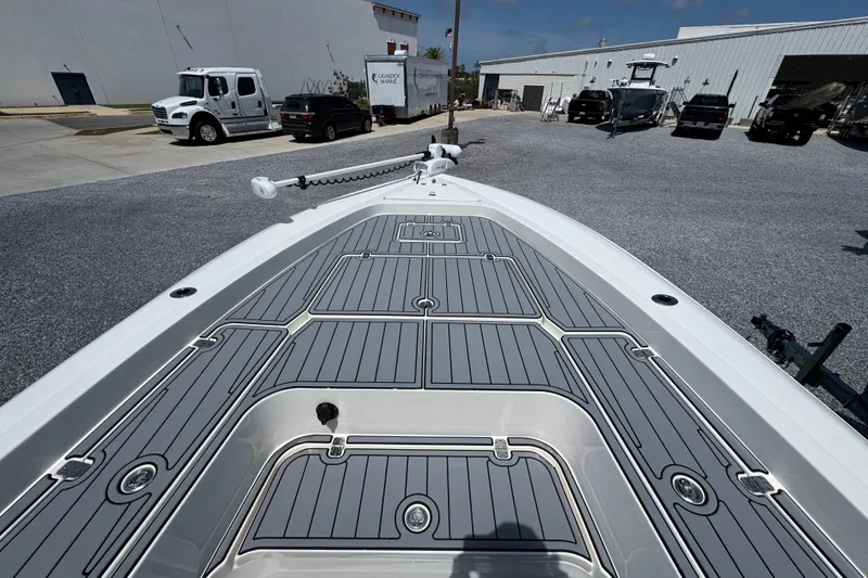 Slide: The Image of Bow view of 2019 ShearWater 270 Carolina Flare boat at a marina. - 14