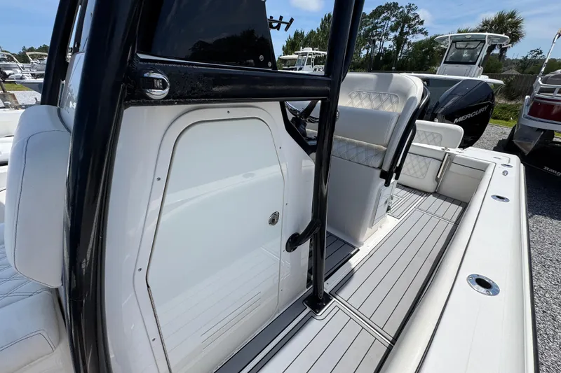 Slide: The Image of 2019 ShearWater 270 Carolina Flare boat interior with seating and console details. - 20