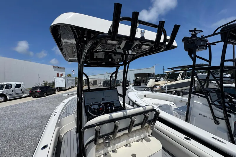 Slide: The Image of 2019 ShearWater 270 Carolina Flare boat with T-top and Garmin electronics, docked under clear skies. - 31