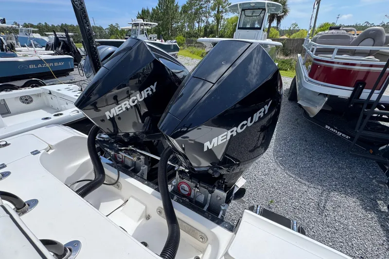 Slide: The Image of Twin Mercury outboard engines on a 2019 ShearWater 270 Carolina Flare boat. - 34