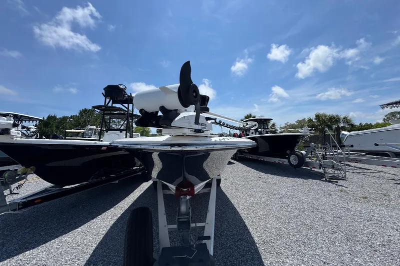 Slide: The Image of 2019 ShearWater 270 Carolina Flare boat on trailer under clear blue sky. - 5