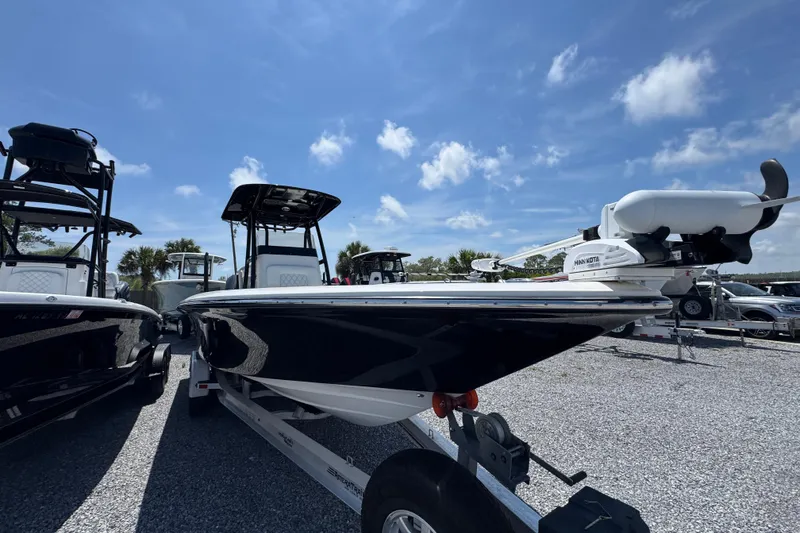 Slide: The Image of 2019 ShearWater 270 Carolina Flare boat on trailer under blue sky. - 6