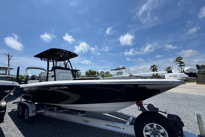 Slide: The Image of 2019 ShearWater 270 Carolina Flare boat on trailer under blue sky. - 7
