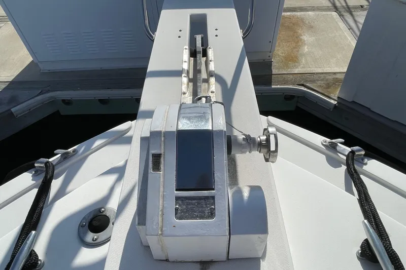 Slide: The Image of Close-up of 1987 Bertram 28 Flybridge boat deck with winch and ropes. - 20