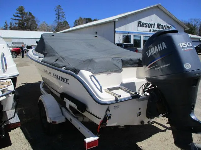 Slide: The Image of 2005 Sea Hunt 186 Escape boat with Yamaha engine, covered, at Resort Marine. - 3