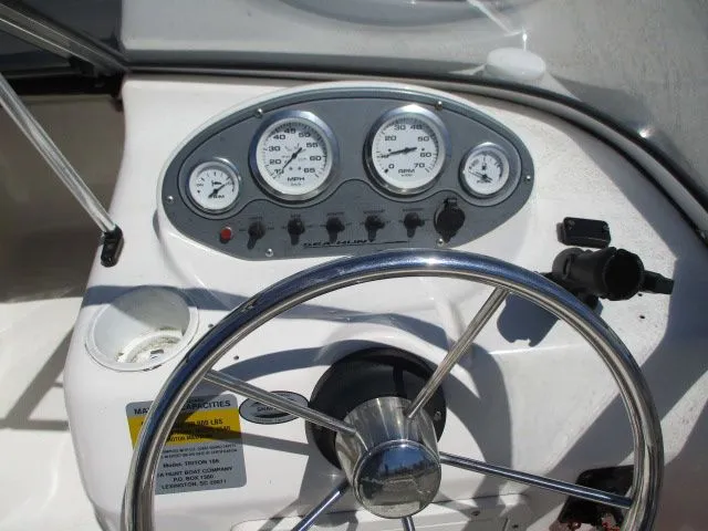 Slide: The Image of Dashboard of a 2005 Sea Hunt 186 Escape boat with gauges. - 9
