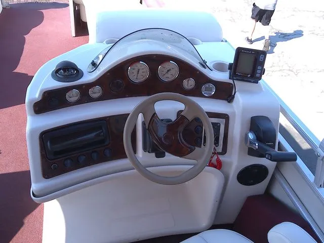 Slide: The Image of Console of a 2002 Godfrey 240 FISH AND FAMILY boat. - 9