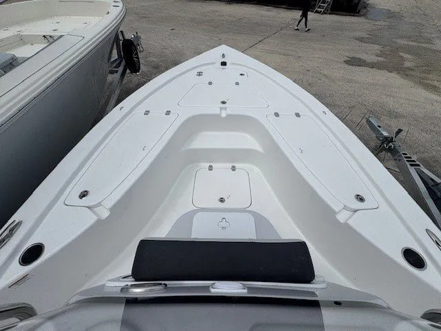 Slide: The Image of 2026 Sea Pro 210DLX boat bow view at dock. - 10