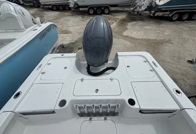 Slide: The Image of Rear view of a 2026 Sea Pro 210DLX boat. - 3
