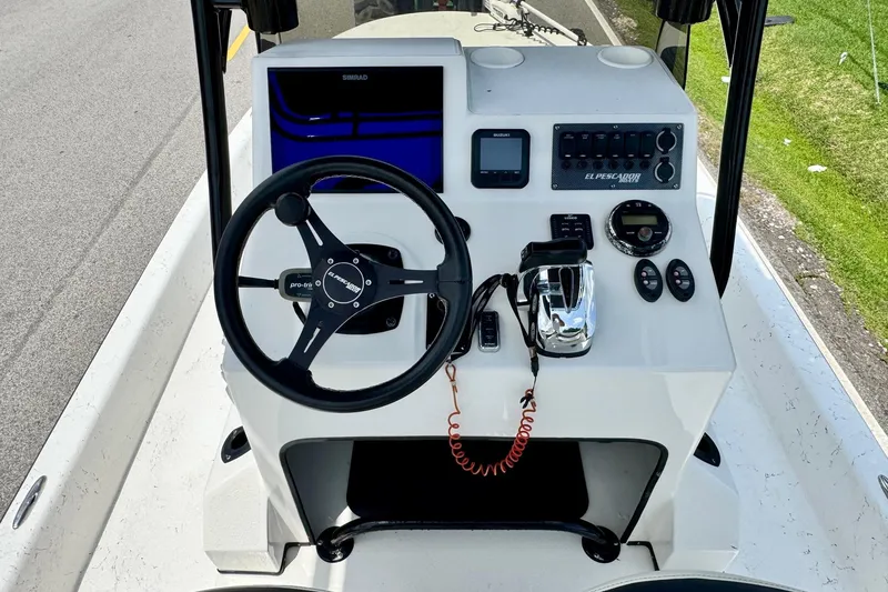 Slide: The Image of Steering console of 2022 El Pescador 24 CAT boat with modern controls and navigation system. - 10