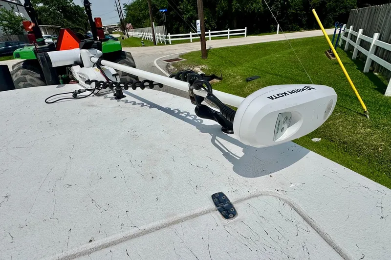 Slide: The Image of El Pescador 24 CAT 2022 boat with Minn Kota trolling motor on deck. - 16