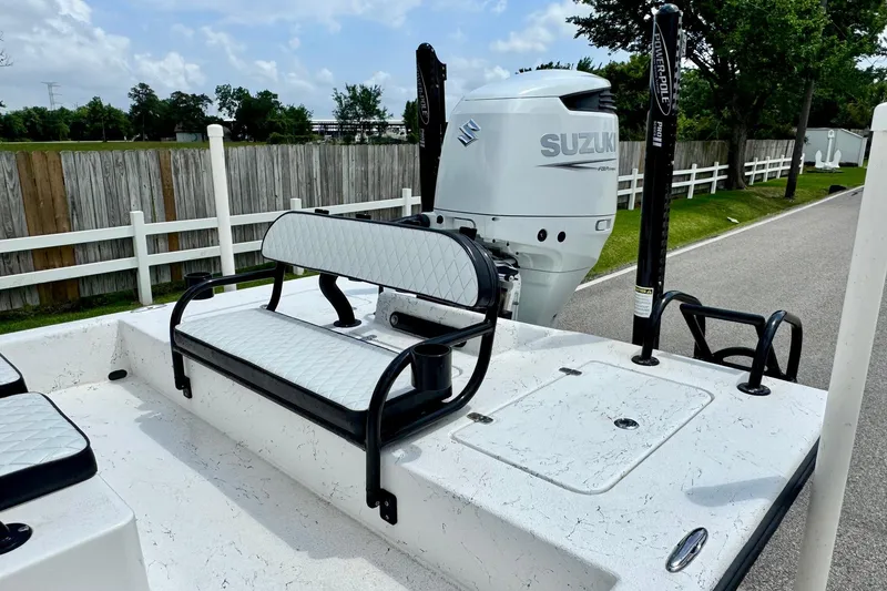 Slide: The Image of 2022 El Pescador 24 CAT boat with Suzuki engine, featuring white seating and Power-Pole anchors. - 7