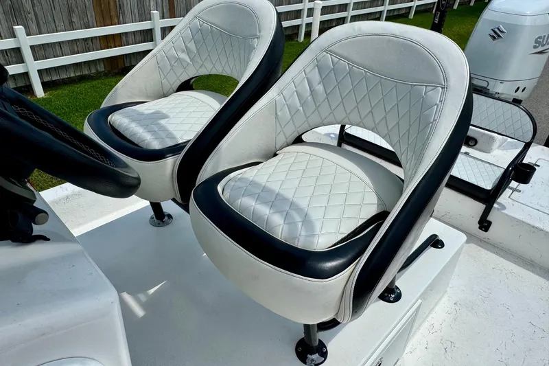Slide: The Image of Luxury seating on 2022 El Pescador 24 CAT boat, featuring quilted white upholstery. - 9