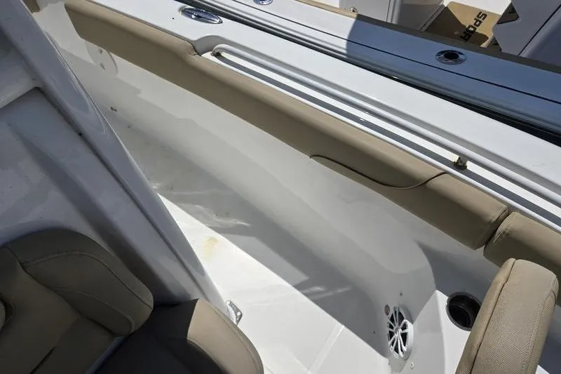 Slide: The Image of Interior view of a 2016 Sea Hunt Gamefish 25 boat, featuring seating and storage. - 11
