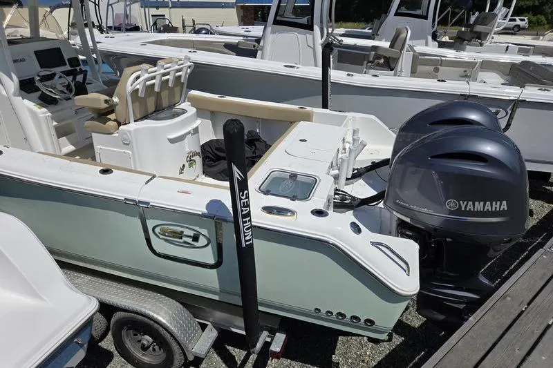 Slide: The Image of 2016 Sea Hunt Gamefish 25 boat with Yamaha engines on a trailer. - 17