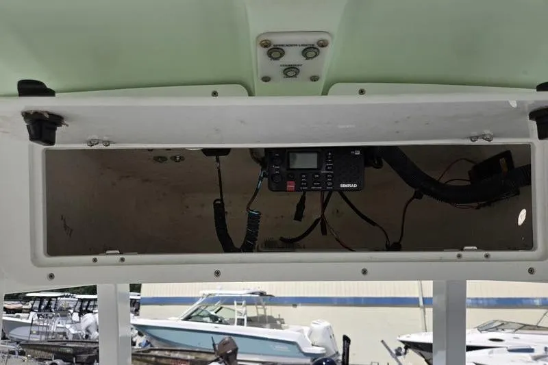 Slide: The Image of 2016 Sea Hunt Gamefish 25 boat console with electronic equipment and wiring. - 4