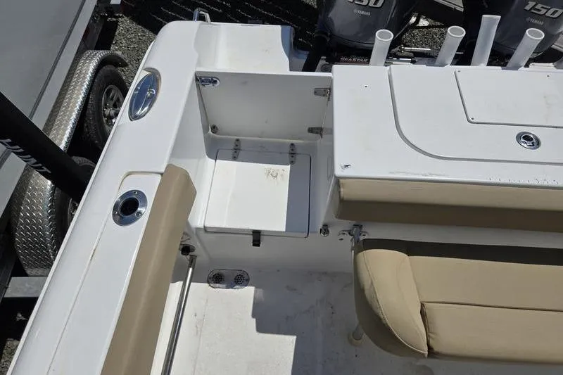 Slide: The Image of 2016 Sea Hunt Gamefish 25 boat interior with seating and storage compartments. - 7