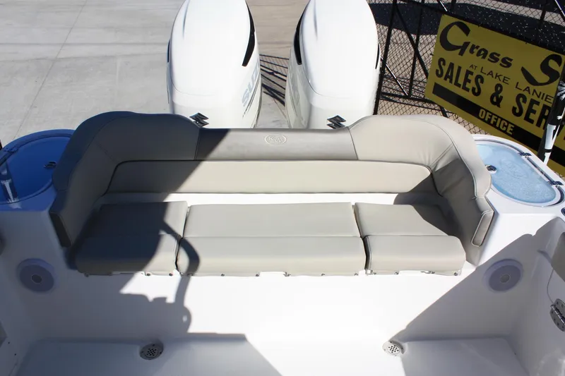 Slide: The Image of Key West 263 FS 2023 boat rear seating with engines in background. - 24