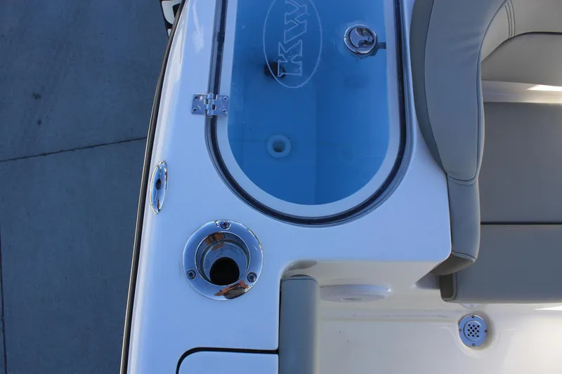 Slide: The Image of Key West 263 FS 2023 boat with seating area and storage. - 26