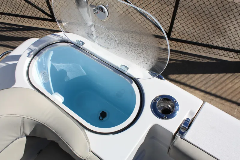 Slide: The Image of Key West 263 FS 2023 boat with open livewell compartment. - 27
