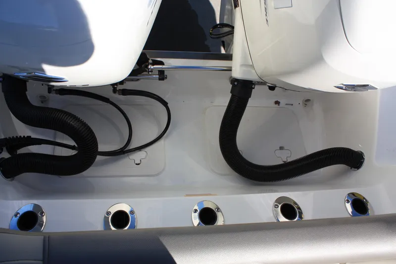 Slide: The Image of Key West 263 FS 2023 boat engine and hoses detail view. - 30