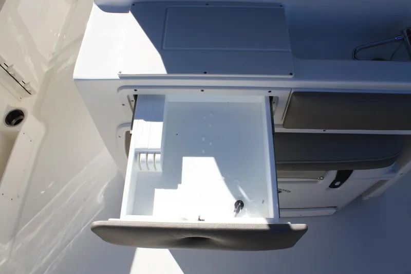 Slide: The Image of Open storage compartment in Key West 263 FS boat, 2023 model. - 31