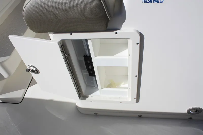 Slide: The Image of 2023 Key West 263 FS boat with open storage compartment. - 34
