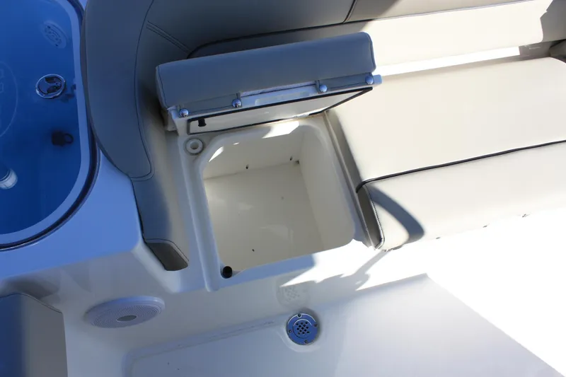 Slide: The Image of Interior of Key West 263 FS boat, seating area with storage compartment. - 38