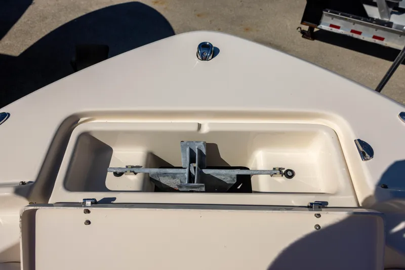 Slide: The Image of 2018 Grady-White Freedom 215 boat anchor compartment, open and empty. - 12