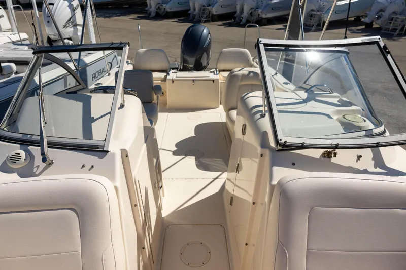 Slide: The Image of 2018 Grady-White Freedom 215 boat interior with dual consoles and seating. - 13