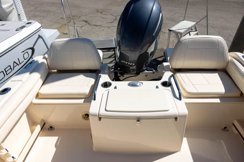 Slide: The Image of 2018 Grady-White Freedom 215 boat interior with seating and outboard motor. - 4